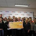A 30-person winner pool comprised of employees at Jordan?s Furniture in Nashua claimed a $1 million Powerball prize Wednesday at New Hampshire Lottery headquarters.